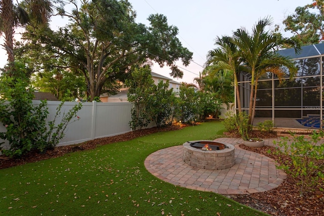 3307 W Knights Ave, Tampa, FL 33611 - fenced backyard with a fire pit and a patio