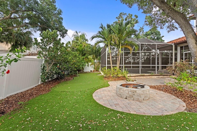 3307 W Knights Ave, Tampa, FL 33611 - fenced backyard with an area to practice putting, a lanai, and an outdoor fire pit