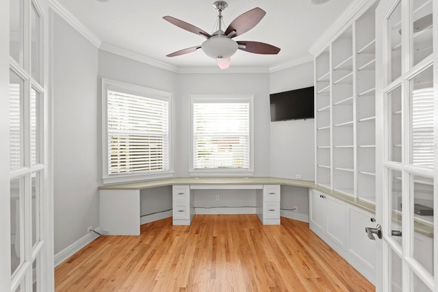 3307 W Knights Ave, Tampa, FL 33611 - unfurnished office featuring built in desk, light wood finished floors, ceiling fan, ornamental molding, and french doors