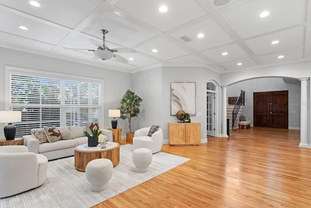 3307 W Knights Ave, Tampa, FL 33611 - living room with ornate columns, coffered ceiling, arched walkways, ceiling fan, and light wood-style floors