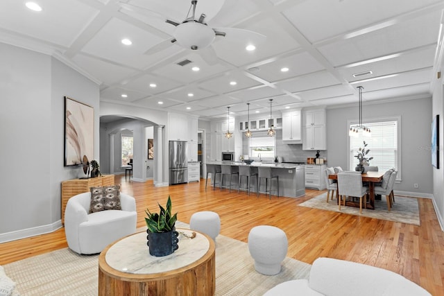 3307 W Knights Ave, Tampa, FL 33611 - living area with coffered ceiling, recessed lighting, arched walkways, light wood-type flooring, and a ceiling fan