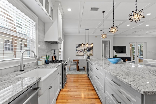 3307 W Knights Ave, Tampa, FL 33611 - kitchen featuring stainless steel appliances, coffered ceiling, recessed lighting, white cabinetry, and pendant lighting