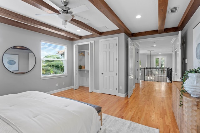 3307 W Knights Ave, Tampa, FL 33611 - bedroom with beam ceiling, light wood finished floors, two closets, recessed lighting, and a ceiling fan
