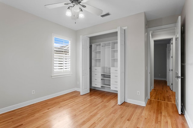 3307 W Knights Ave, Tampa, FL 33611 - unfurnished bedroom featuring light wood-style flooring, a closet, and a ceiling fan
