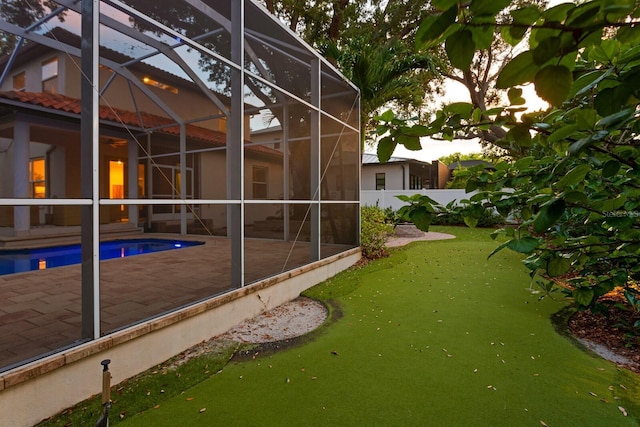 3307 W Knights Ave, Tampa, FL 33611 - view of property exterior featuring glass enclosure, a patio area, and an outdoor pool