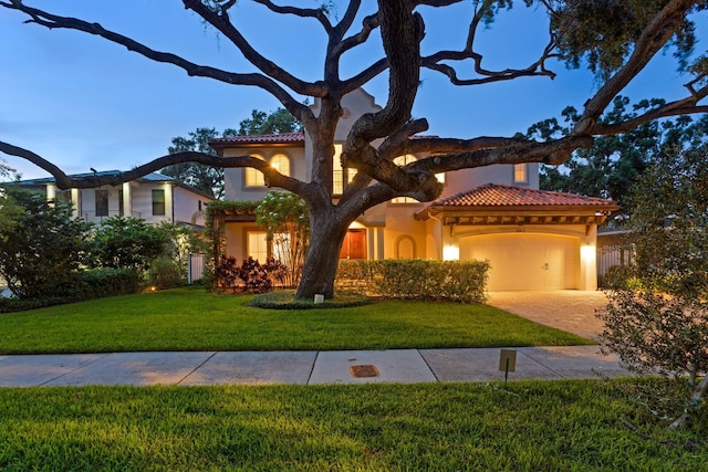 3307 W Knights Ave, Tampa, FL 33611 - mediterranean / spanish house featuring a tile roof and stucco siding