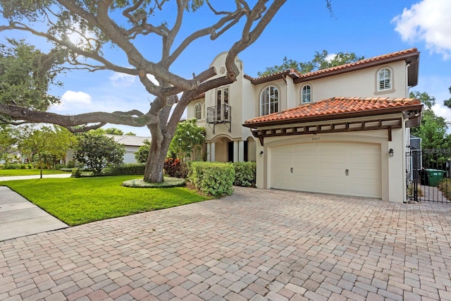 3307 W Knights Ave, Tampa, FL 33611 - mediterranean / spanish house with decorative driveway, stucco siding, a gate, and an attached garage