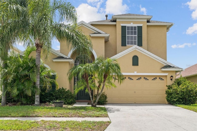 3013 Silvermill Loop Unit O, Land O Lakes, FL 34638 - view of front of house with concrete driveway and stucco siding