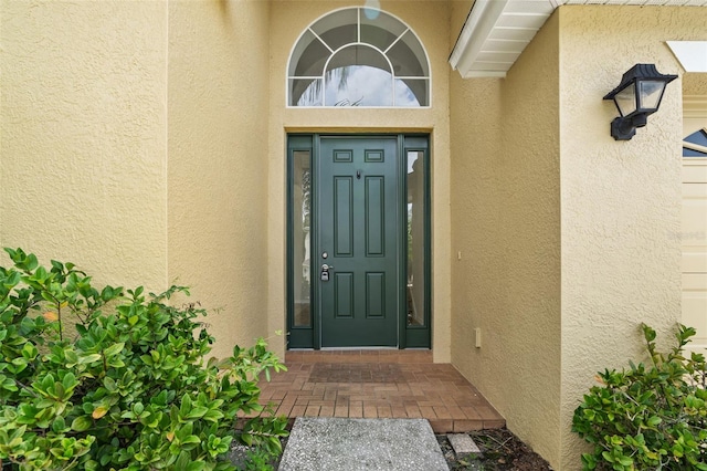 3013 Silvermill Loop Unit O, Land O Lakes, FL 34638 - doorway to property featuring stucco siding