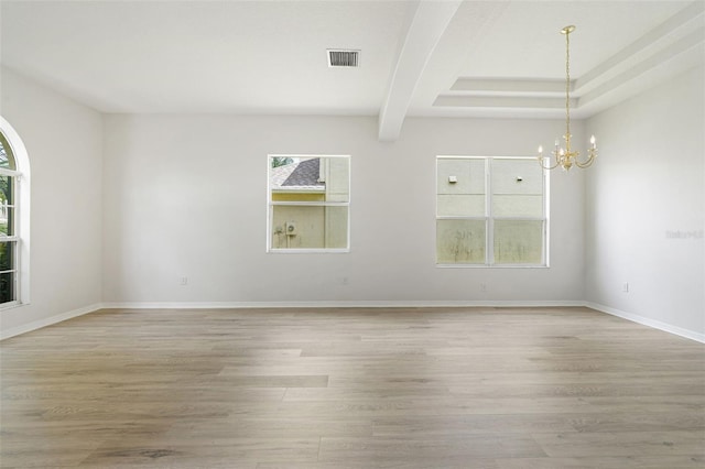 3013 Silvermill Loop Unit O, Land O Lakes, FL 34638 - spare room featuring a chandelier, light wood-style floors, and beamed ceiling