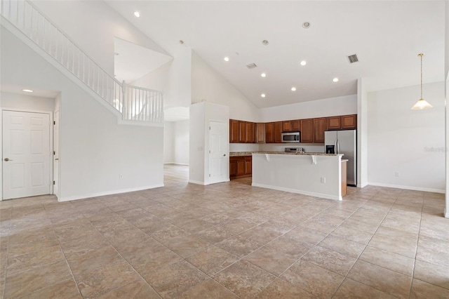 3013 Silvermill Loop Unit O, Land O Lakes, FL 34638 - unfurnished living room featuring high vaulted ceiling and recessed lighting