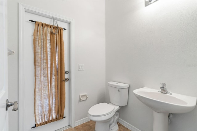 3013 Silvermill Loop Unit O, Land O Lakes, FL 34638 - bathroom with toilet and tile patterned flooring