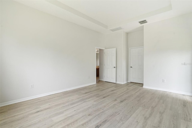3013 Silvermill Loop Unit O, Land O Lakes, FL 34638 - unfurnished room with light wood-style flooring and a towering ceiling