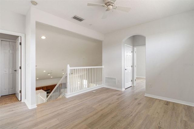 3013 Silvermill Loop Unit O, Land O Lakes, FL 34638 - unfurnished room with arched walkways, light wood-type flooring, a smoke detector, ceiling fan, and recessed lighting