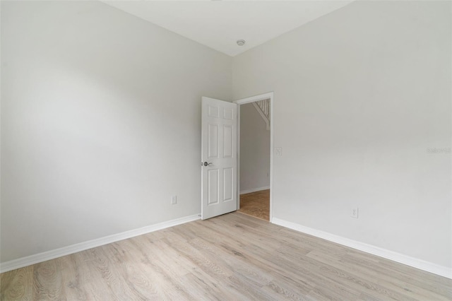 3013 Silvermill Loop Unit O, Land O Lakes, FL 34638 - empty room featuring light wood-style floors and baseboards