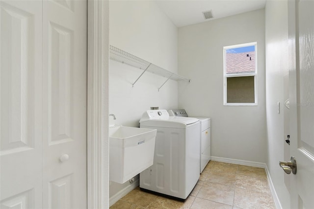 3013 Silvermill Loop Unit O, Land O Lakes, FL 34638 - laundry area featuring washer and dryer and light tile patterned floors