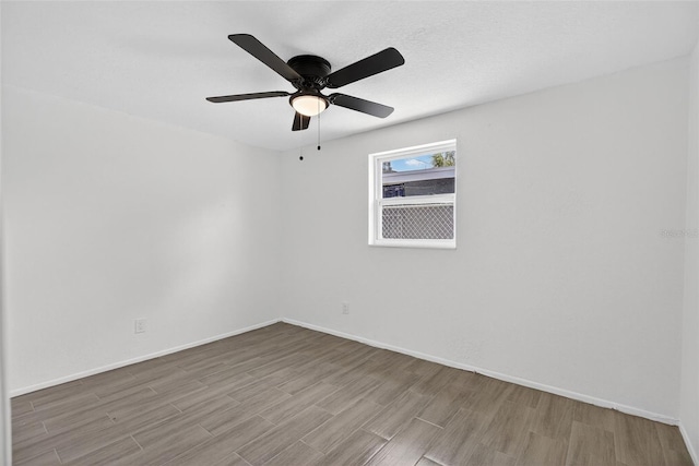 4535 15th Ave S, Saint Petersburg, FL 33711 - unfurnished room with wood finished floors and ceiling fan