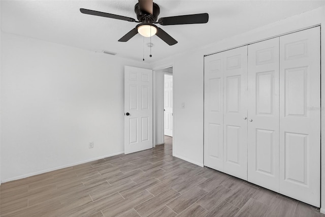 4535 15th Ave S, Saint Petersburg, FL 33711 - unfurnished bedroom featuring light wood-type flooring, a closet, and ceiling fan