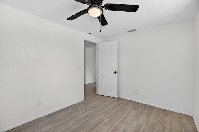 4535 15th Ave S, Saint Petersburg, FL 33711 - empty room with light wood-style floors and ceiling fan