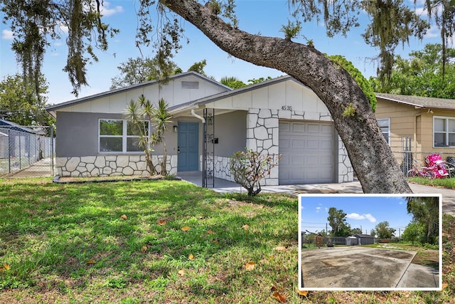 4535 15th Ave S, Saint Petersburg, FL 33711 - ranch-style home featuring an attached garage and board and batten siding