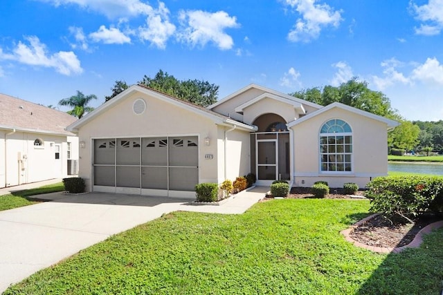 4407 Whitton Way, New Port Richey, FL 34653 - ranch-style house featuring a garage, stucco siding, driveway, and a front yard