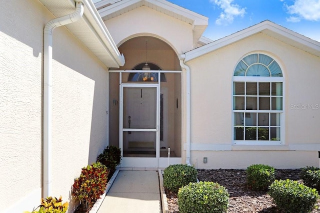 4407 Whitton Way, New Port Richey, FL 34653 - doorway to property with stucco siding