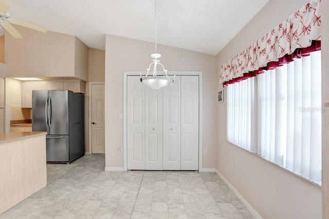 4407 Whitton Way, New Port Richey, FL 34653 - unfurnished dining area featuring a chandelier, lofted ceiling, and ceiling fan