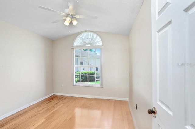 4407 Whitton Way, New Port Richey, FL 34653 - empty room featuring light wood-style flooring, vaulted ceiling, and a ceiling fan
