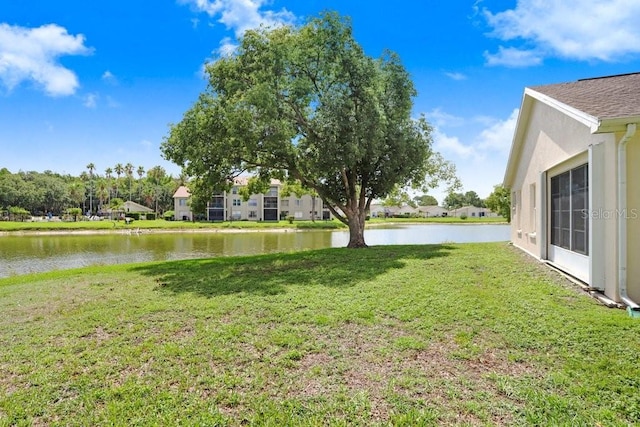 4407 Whitton Way, New Port Richey, FL 34653 - view of grassy yard with a water view