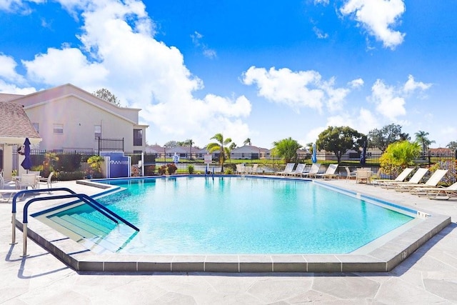 4407 Whitton Way, New Port Richey, FL 34653 - community pool with a patio area