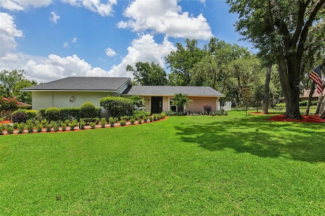 126 Holly Tree Ln, Brandon, FL 33511 - view of front of house with a front lawn and stucco siding