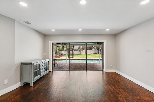 126 Holly Tree Ln, Brandon, FL 33511 - unfurnished room featuring dark wood-style floors and recessed lighting