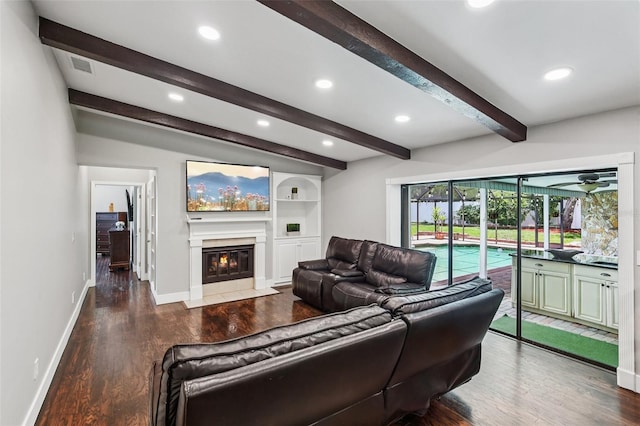 126 Holly Tree Ln, Brandon, FL 33511 - living area with wood finished floors, a fireplace with flush hearth, beamed ceiling, recessed lighting, and a ceiling fan