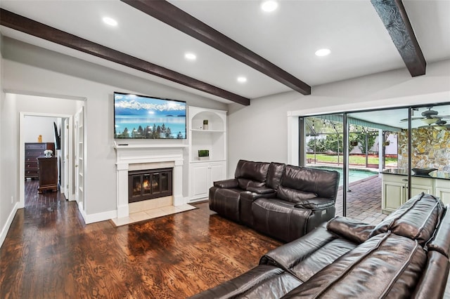126 Holly Tree Ln, Brandon, FL 33511 - living area featuring wood finished floors, a fireplace with flush hearth, recessed lighting, beam ceiling, and a ceiling fan