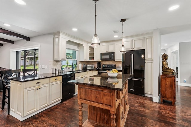 126 Holly Tree Ln, Brandon, FL 33511 - kitchen featuring black appliances, tasteful backsplash, recessed lighting, a kitchen breakfast bar, and dark wood-style floors