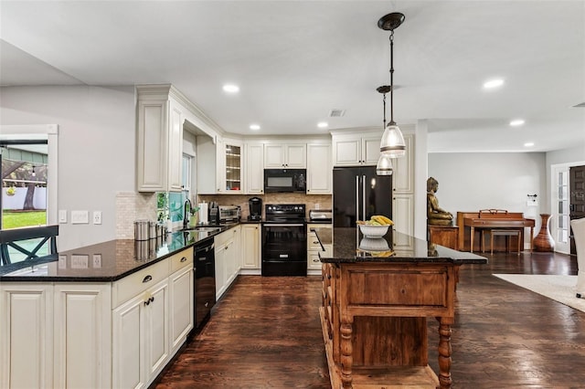126 Holly Tree Ln, Brandon, FL 33511 - kitchen with black appliances, decorative backsplash, dark wood-style floors, recessed lighting, and glass insert cabinets