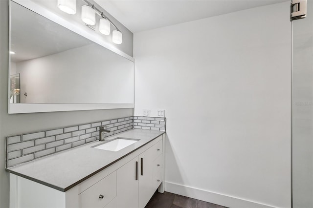 126 Holly Tree Ln, Brandon, FL 33511 - bathroom featuring vanity, decorative backsplash, and wood finished floors