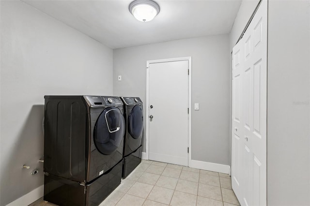 126 Holly Tree Ln, Brandon, FL 33511 - laundry area featuring washer and dryer and light tile patterned floors