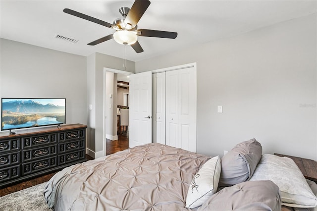 126 Holly Tree Ln, Brandon, FL 33511 - bedroom featuring a closet, a ceiling fan, and wood finished floors
