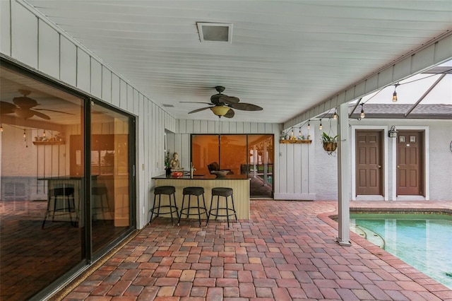 126 Holly Tree Ln, Brandon, FL 33511 - view of patio featuring a ceiling fan, an outdoor pool, and a bar