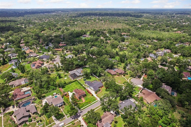 126 Holly Tree Ln, Brandon, FL 33511 - aerial overview of property's location with nearby suburban area and a heavily wooded area