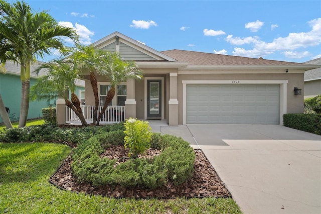 6408 Seasound Dr, Apollo Beach, FL 33572 - single story home with covered porch, driveway, an attached garage, and stucco siding