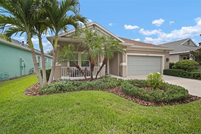 6408 Seasound Dr, Apollo Beach, FL 33572 - ranch-style house with stucco siding, an attached garage, a front yard, concrete driveway, and a porch
