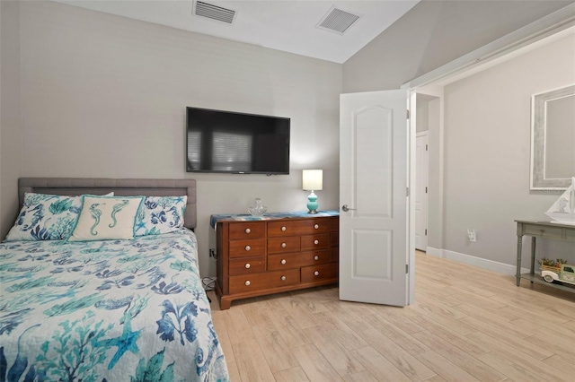 6408 Seasound Dr, Apollo Beach, FL 33572 - bedroom with vaulted ceiling and light wood-type flooring