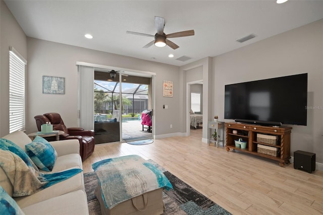 6408 Seasound Dr, Apollo Beach, FL 33572 - living area featuring ceiling fan, light wood-style flooring, recessed lighting, and a sunroom