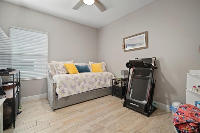 6408 Seasound Dr, Apollo Beach, FL 33572 - bedroom with light wood-style floors and ceiling fan