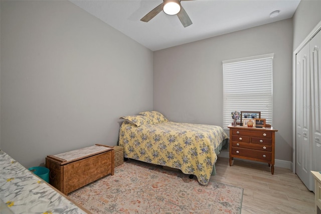 6408 Seasound Dr, Apollo Beach, FL 33572 - bedroom with a closet, light wood-style floors, and ceiling fan