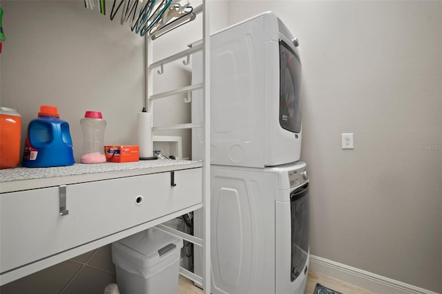 6408 Seasound Dr, Apollo Beach, FL 33572 - laundry area featuring estacked washer and dryer and baseboards