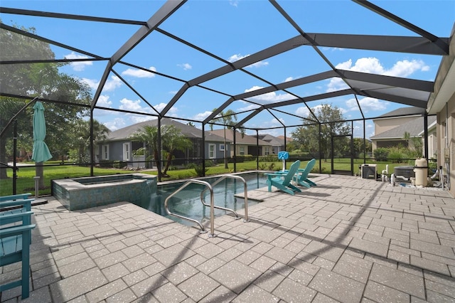 6408 Seasound Dr, Apollo Beach, FL 33572 - view of pool featuring a patio, glass enclosure, and a pool with connected hot tub