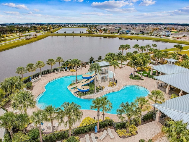 6408 Seasound Dr, Apollo Beach, FL 33572 - community pool with a water slide, a water view, and a patio